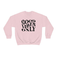 A unisex heavy blend crewneck sweatshirt featuring Good Vibes Only design. Comfortable, loose fit with ribbed knit collar. 50% cotton, 50% polyester, medium-heavy fabric. Sewn-in label, true to size.