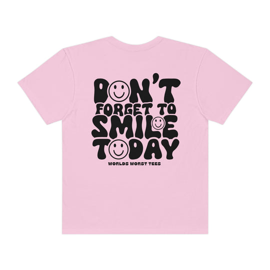 A garment-dyed tee made of 100% ring-spun cotton, featuring a relaxed fit and durable double-needle stitching. Don't Forget To Smile Today Tee by Worlds Worst Tees.