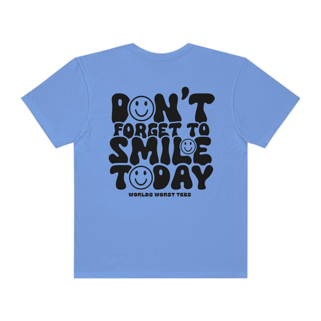 Blue t-shirt with black text and smiley faces, featuring a relaxed fit for daily comfort. Made of 100% ring-spun cotton, garment-dyed for extra coziness. Durable double-needle stitching, no side-seams for a tubular shape.