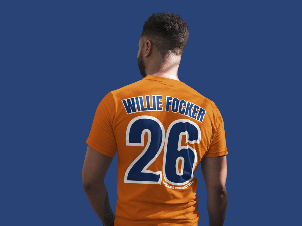 A relaxed fit Houston Asshats #26 Willie Focker Tee in orange with blue text and numbers. 100% ring-spun cotton, garment-dyed, soft-washed fabric, double-needle stitching, no side-seams for durability and comfort.
