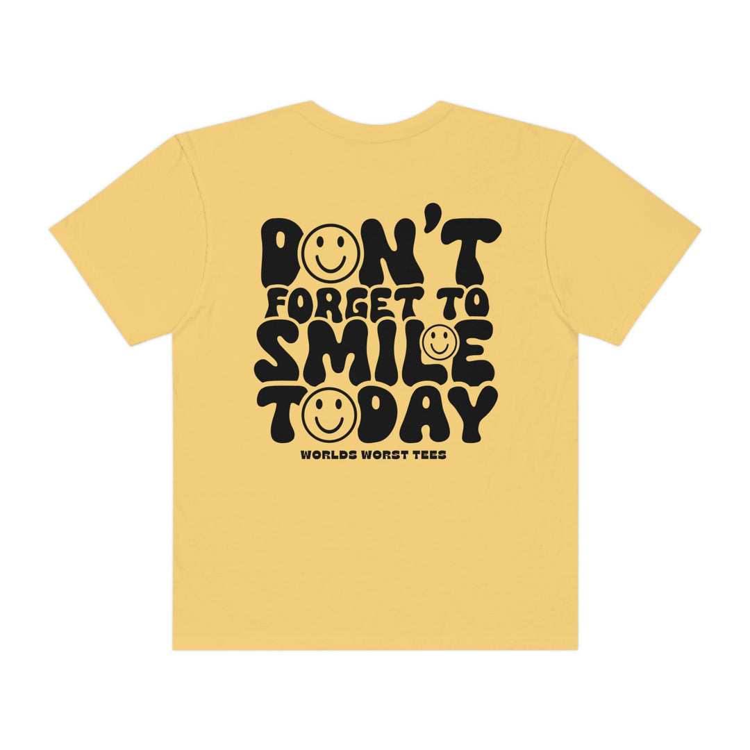 A relaxed-fit, ring-spun cotton tee featuring Don't Forget To Smile Today text. Garment-dyed for coziness, with double-needle stitching for durability and a seamless design for a tubular shape.
