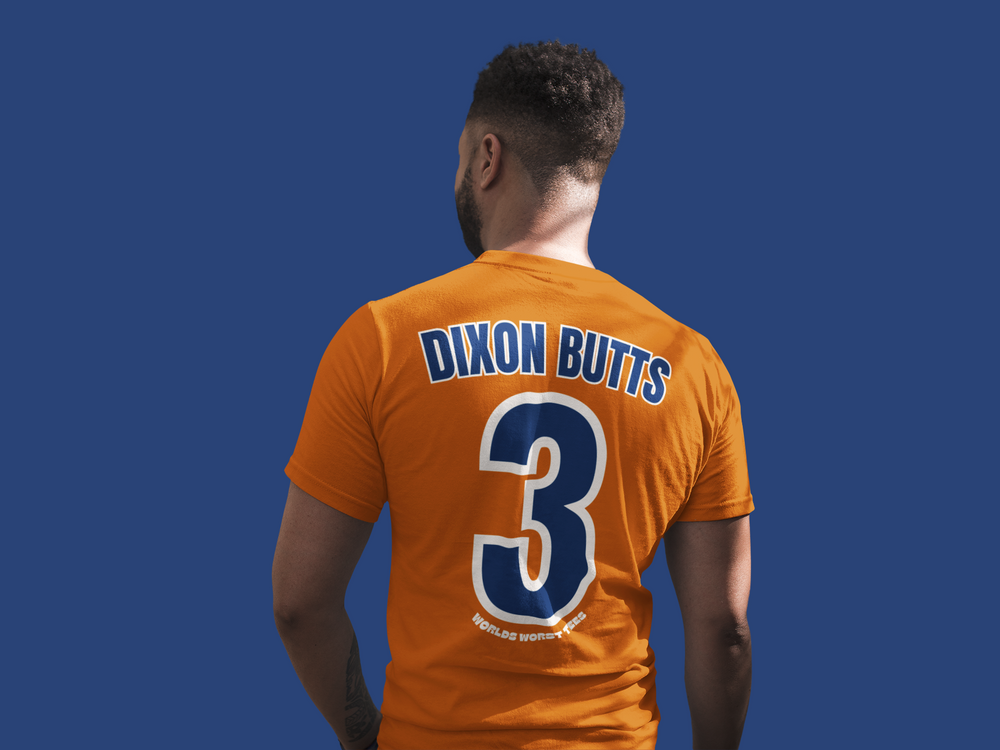 A relaxed fit Houston Asshats #Dixon Butts Tee in orange with a number, made of 100% ring-spun cotton for cozy daily wear. Double-needle stitching for durability and tubular shape retention.