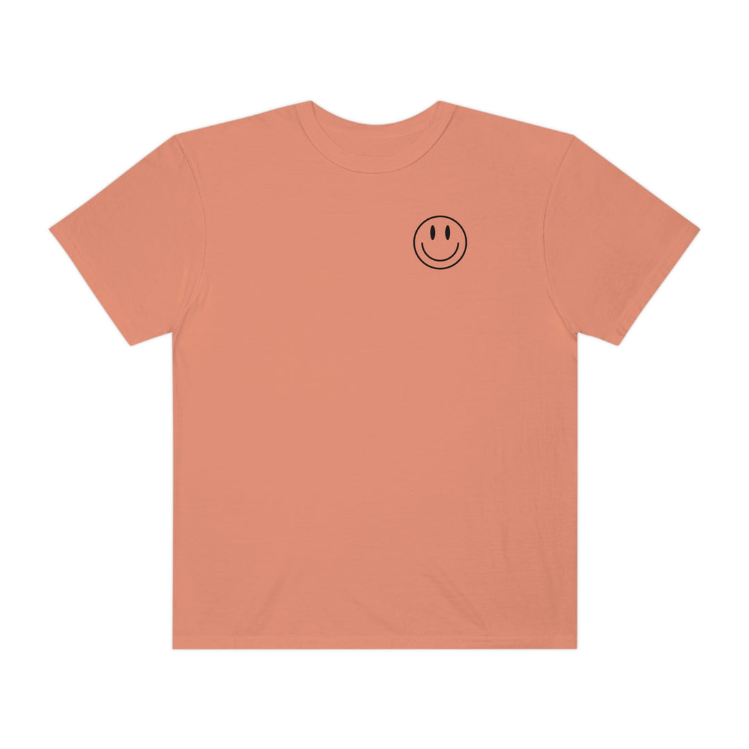 A cozy, ring-spun cotton tee featuring a smiley face design. Garment-dyed for softness, with a relaxed fit and durable double-needle stitching. Perfect for daily wear. From 'Worlds Worst Tees'.