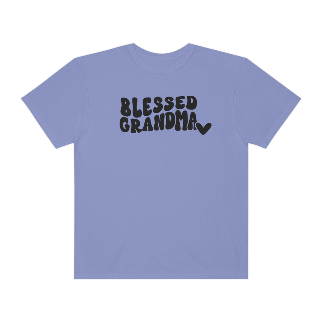 A Blessed Grandma Tee, a purple shirt with black text, 100% ring-spun cotton, medium weight, relaxed fit, durable double-needle stitching, seamless design for comfort and style.