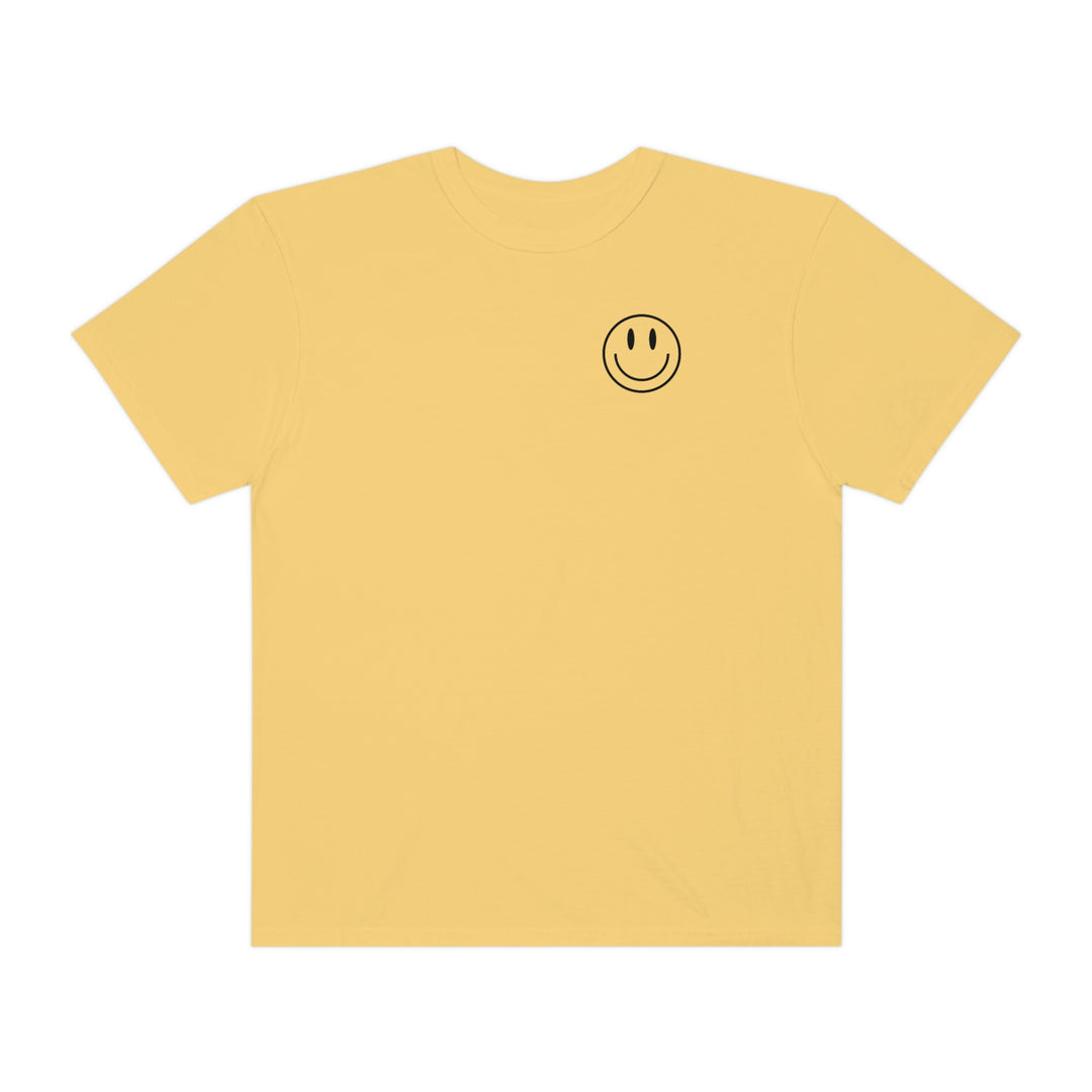 A relaxed fit Don't Forget To Smile Today Tee, featuring a yellow smiley face design on a soft, ring-spun cotton shirt. Double-needle stitching for durability and seamless sides for a tubular shape.