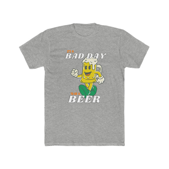 A grey t-shirt featuring a cartoon beer mug and a yellow-gloved hand, titled It's A Bad Day to be a Beer Tee. Made of 100% ring-spun cotton with a relaxed fit and durable double-needle stitching.