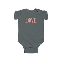 A grey baby bodysuit featuring pink text and a pink flower, designed for comfort and durability. Made of 100% cotton fabric, with ribbed knitting for lasting quality. Plastic snaps for easy changing access. From Worlds Worst Tees.