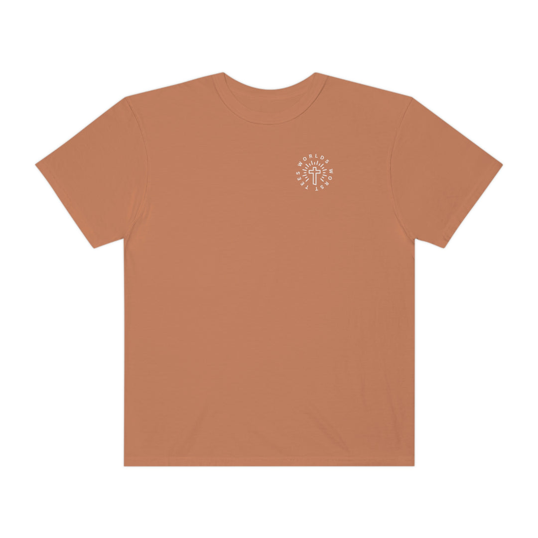 A Blessed Mom Tee, a brown t-shirt with a logo featuring a cross. 100% ring-spun cotton, garment-dyed for extra coziness. Relaxed fit, double-needle stitching for durability, seamless design. Sizes S to 3XL.