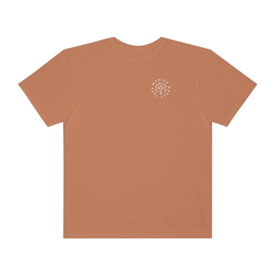 A Blessed Mom Tee, a brown t-shirt with a logo featuring a cross. 100% ring-spun cotton, garment-dyed for extra coziness. Relaxed fit, double-needle stitching for durability, seamless design. Sizes S to 3XL.
