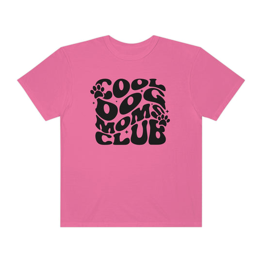 Cool Dog Mom's Club Tee: A pink shirt with black text featuring a unique design. 100% ring-spun cotton, garment-dyed for extra coziness. Relaxed fit, double-needle stitching for durability, and seamless sides for a sleek look.
