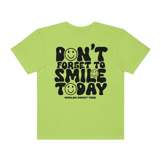 Don't Forget To Smile Today Tee: Back of green shirt with black text and smiley faces. 100% ring-spun cotton, garment-dyed for coziness, relaxed fit, durable double-needle stitching, seamless sides. From Worlds Worst Tees.
