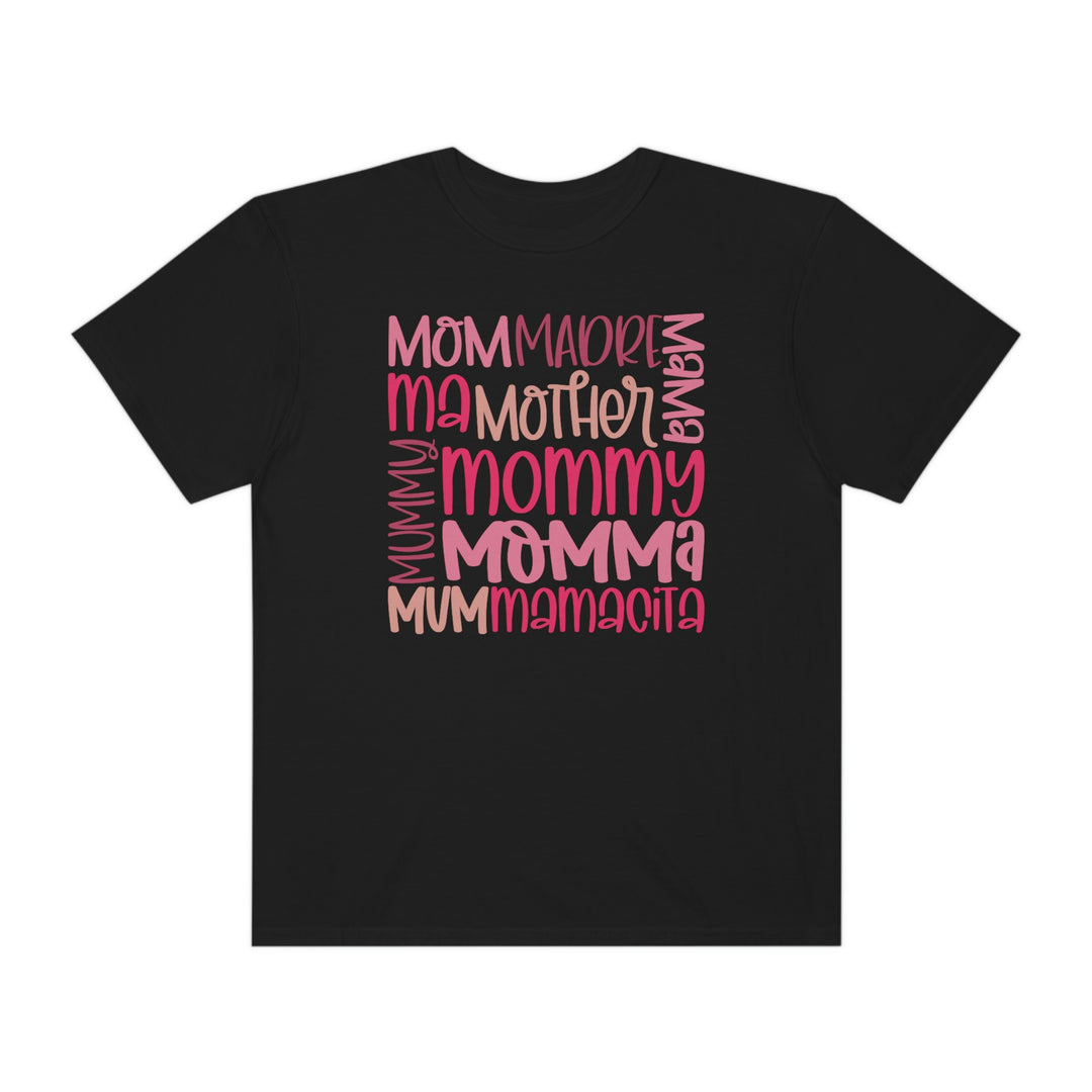 A Mama Tee in black with pink text, made of 100% ring-spun cotton. Garment-dyed for softness, featuring a relaxed fit, double-needle stitching, and no side-seams for durability and comfort.