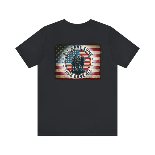 A classic USA Some Gave All Tee, featuring a group of soldiers with a flag on a black shirt. Unisex fit, 100% cotton, ribbed collar, and quality print. Sizes XS to 3XL.