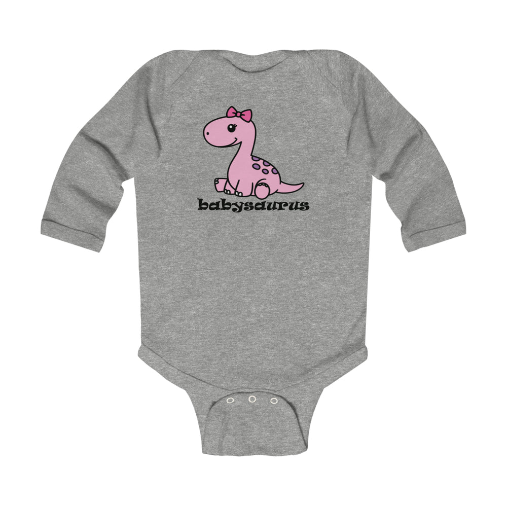 A grey long sleeve baby bodysuit featuring a pink dinosaur design, ideal for durability and comfort. Made of 100% combed ring-spun cotton with plastic snaps for easy changing. From Worlds Worst Tees.