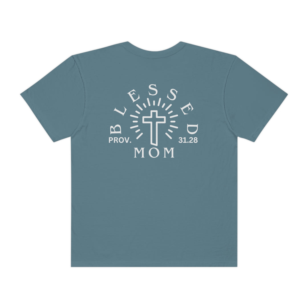 Blessed Mom Tee: Back view of a blue shirt with white text, featuring a cross design. Made of 100% ring-spun cotton, garment-dyed for extra softness. Relaxed fit, double-needle stitching for durability, and seamless sides for a sleek look.