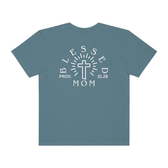 Blessed Mom Tee: Back view of a blue shirt with white text, featuring a cross design. Made of 100% ring-spun cotton, garment-dyed for extra softness. Relaxed fit, double-needle stitching for durability, and seamless sides for a sleek look.