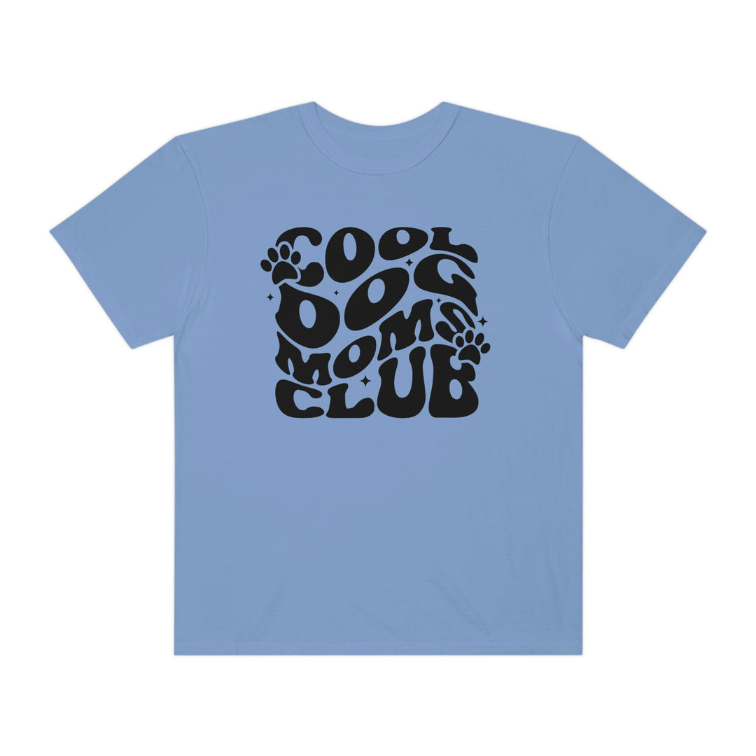 Cool Dog Mom's Club Tee: A blue t-shirt featuring black text and a logo, made of 100% ring-spun cotton. Relaxed fit, durable double-needle stitching, and seamless design for comfort.