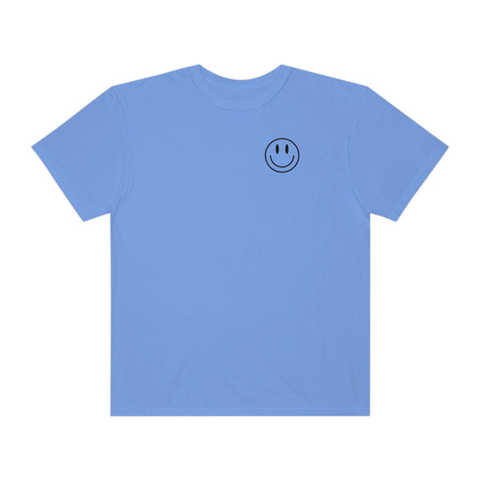 A relaxed fit Don't Forget To Smile Today Tee in blue, featuring a smiley face design on ring-spun cotton. Garment-dyed for coziness, with double-needle stitching for durability. From Worlds Worst Tees.
