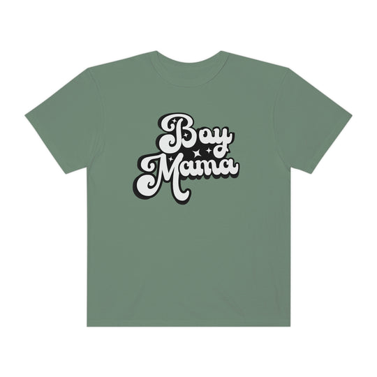 A Boy Mama Tee, a green shirt with white text, 100% ring-spun cotton, medium weight, relaxed fit, double-needle stitching, no side-seams for durability and shape retention.