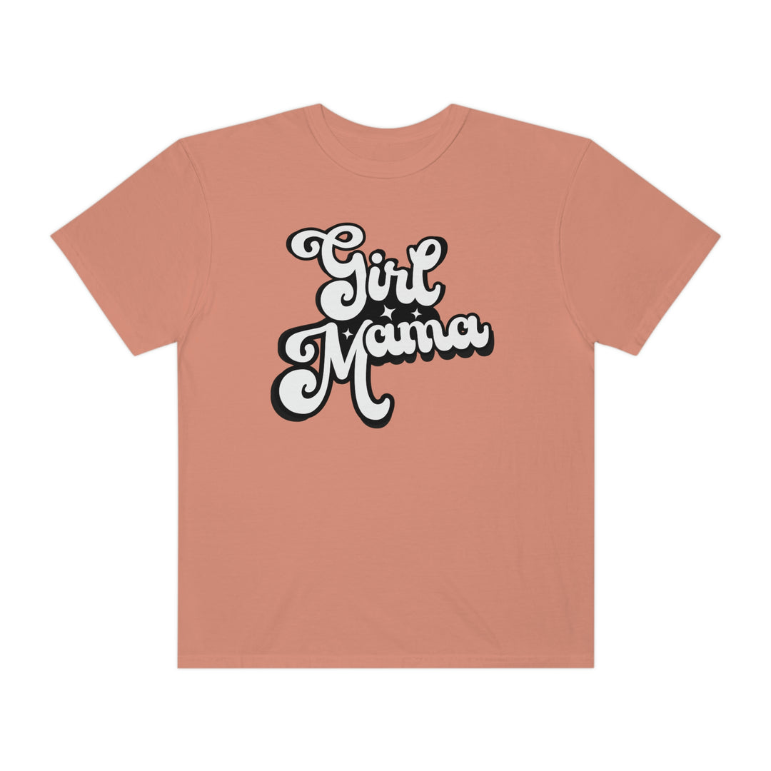 Girl Mama Tee: A pink shirt with white text featuring a black and white cartoon character. 100% ring-spun cotton, garment-dyed for extra coziness, with a relaxed fit and durable double-needle stitching.