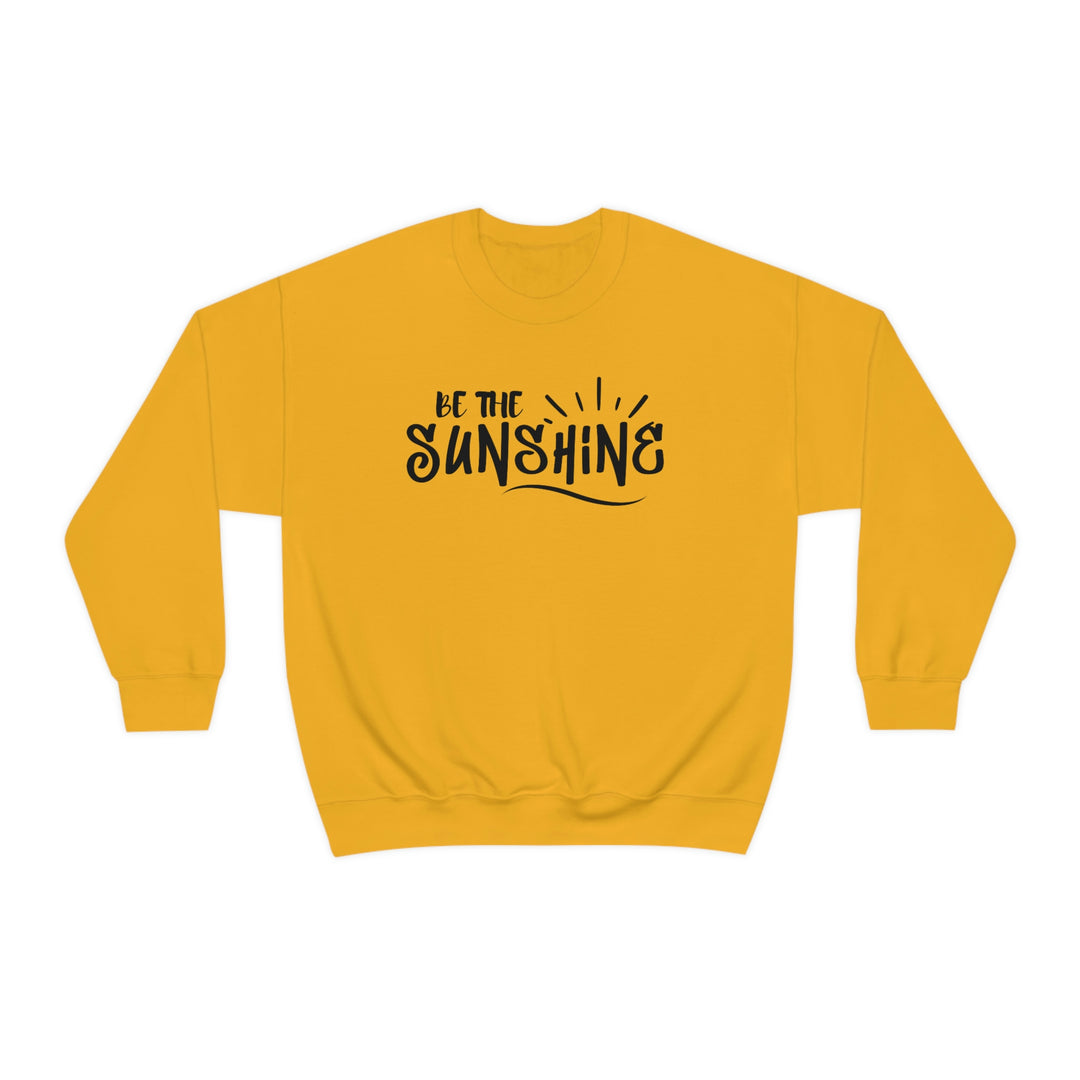 A unisex heavy blend crewneck sweatshirt, Be The Sunshine Crewneck, in yellow with black text. Made of 50% cotton, 50% polyester, medium-heavy fabric, loose fit, ribbed knit collar, no itchy side seams. Sewn-in label, true to size.