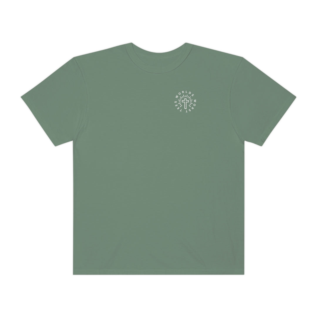 A Blessed Mom Tee: Green shirt with a cross logo. 100% ring-spun cotton, garment-dyed for coziness. Relaxed fit, durable double-needle stitching, no side-seams for tubular shape. Sizes: S-3XL.