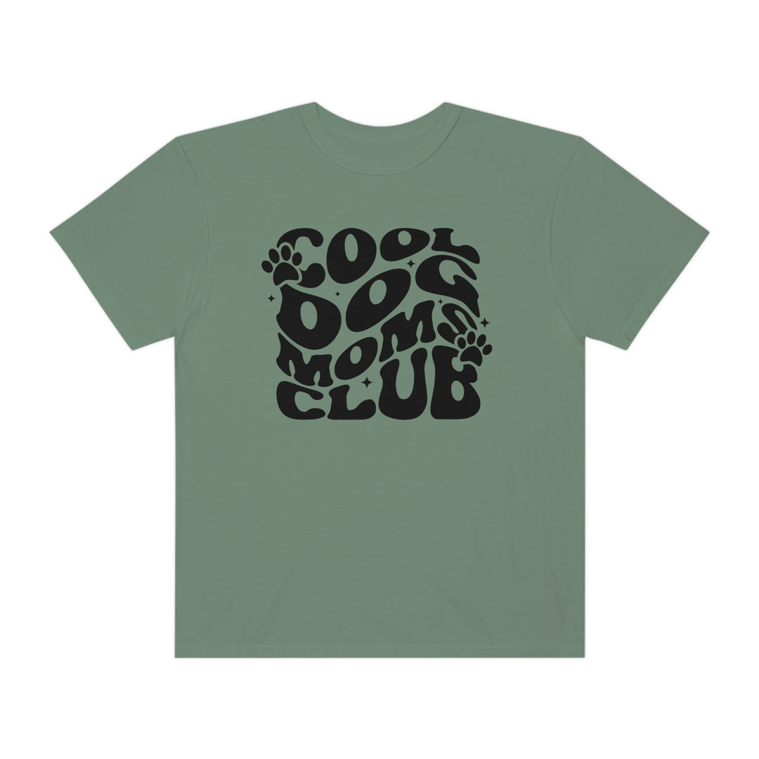 A relaxed fit Cool Dog Mom's Club tee in green with black text, made of 100% ring-spun cotton for extra coziness. Double-needle stitching and seamless design ensure durability and comfort.