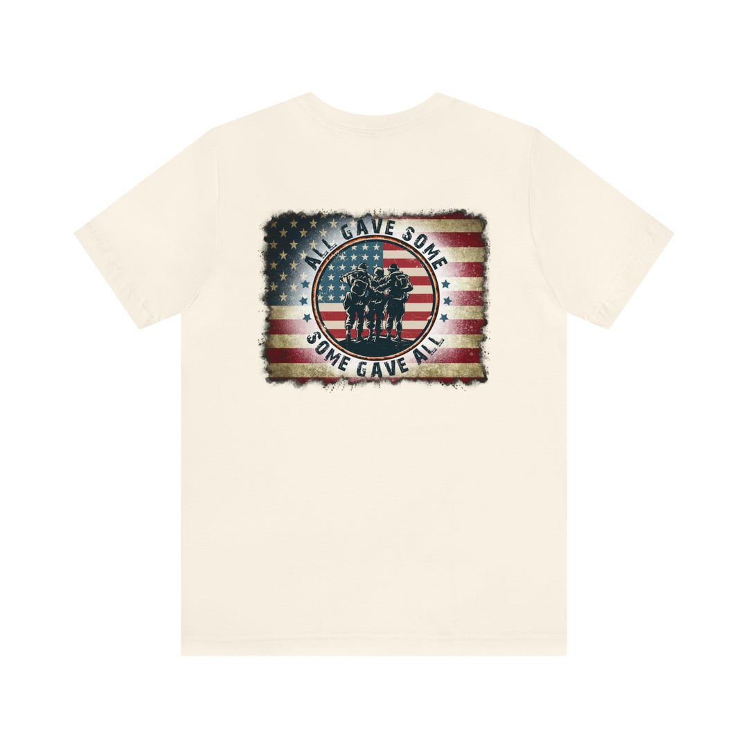 USA Some Gave All Tee: White t-shirt featuring a flag and soldiers design. Unisex jersey tee with ribbed knit collars, Airlume combed cotton, and retail fit. Sizes XS to 3XL.