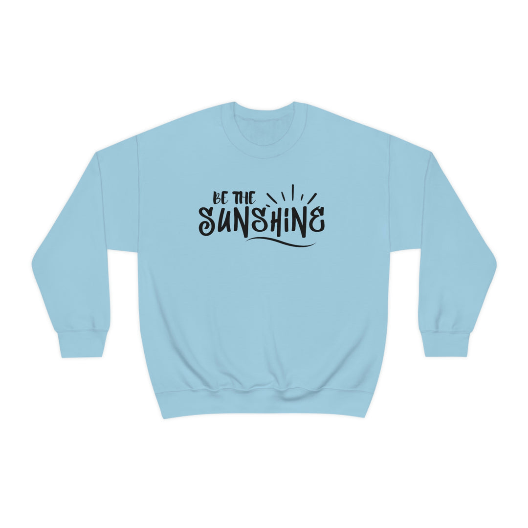 A unisex heavy blend crewneck sweatshirt featuring the Be The Sunshine design. Made of 50% cotton and 50% polyester, with ribbed knit collar and no itchy side seams. Medium-heavy fabric, loose fit, and sewn-in label.