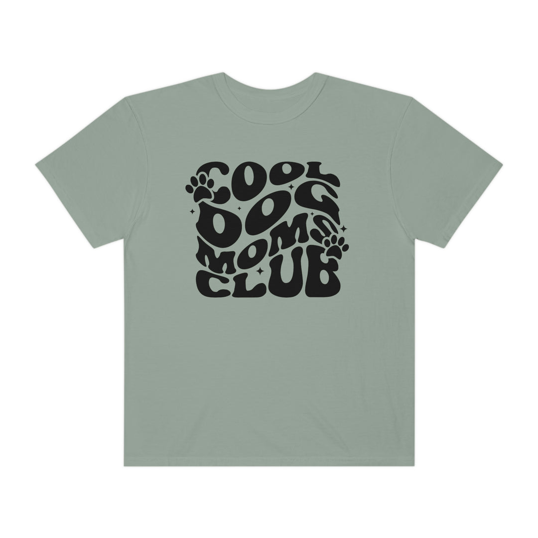 Alt text: Cool Dog Mom's Club Tee: A garment-dyed t-shirt with a black and white logo, made of 100% ring-spun cotton for extra coziness. Features a relaxed fit, double-needle stitching, and seamless design for durability and comfort.