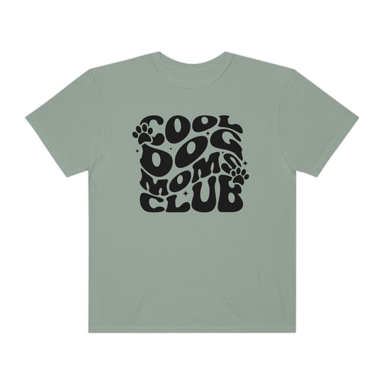 Alt text: Cool Dog Mom's Club Tee: A garment-dyed t-shirt with a black and white logo, made of 100% ring-spun cotton for extra coziness. Features a relaxed fit, double-needle stitching, and seamless design for durability and comfort.