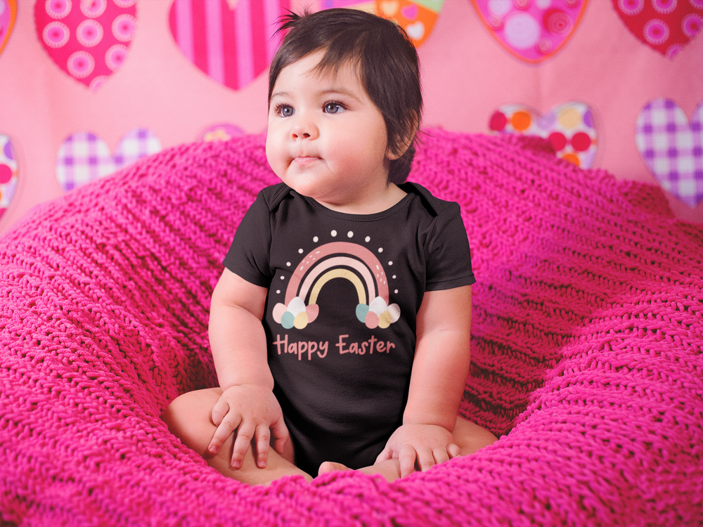 A baby wearing a Happy Easter Rainbow Onesie, featuring lap shoulders for easy dressing and 100% ring-spun cotton for softness. Infant unisex fit, light fabric, perfect for younglings.